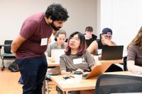 A SHARP attendee asks the instructor a question in a classroom of professional adults